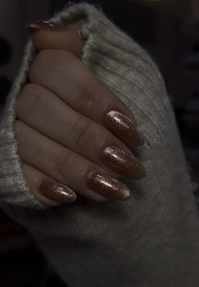 Glossy brown glitter almond nails