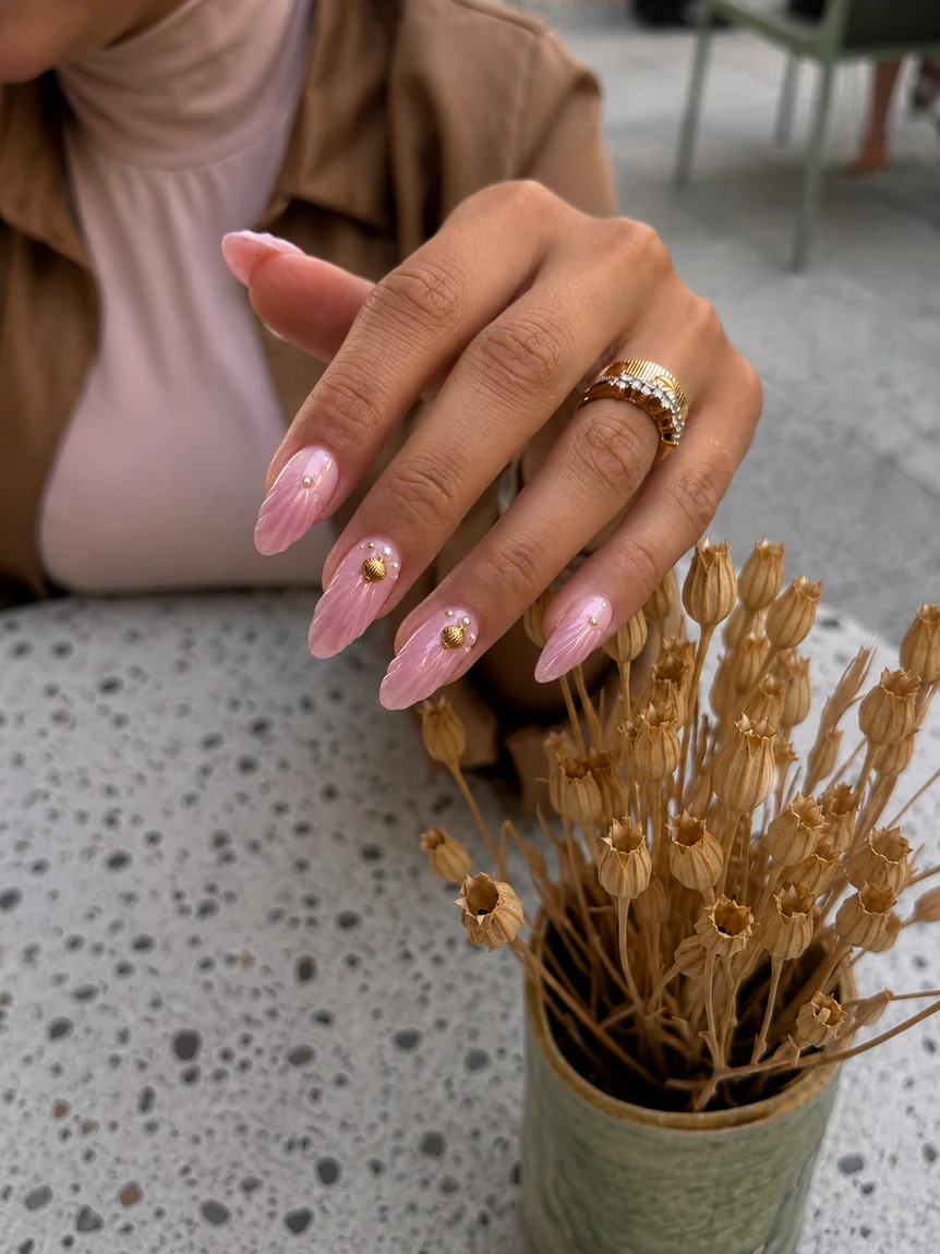 Glazed pink nail art with gold heart detail by Batoul Beauty, Beirut